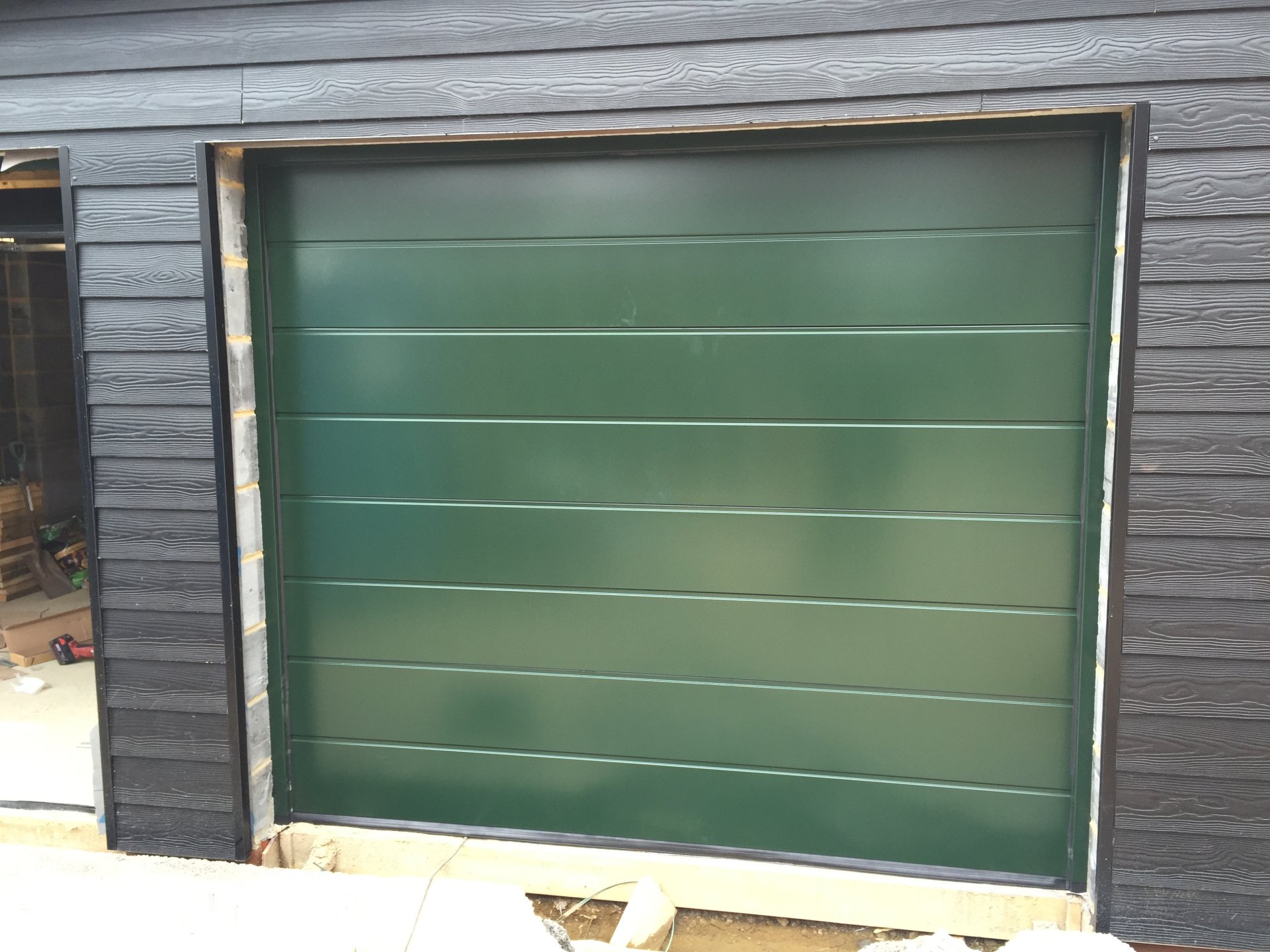 Insulated sectional garage door fully finished in RAL colour